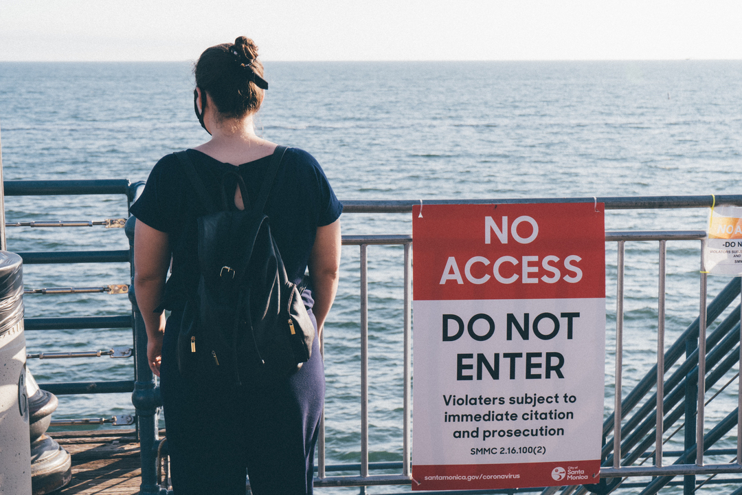 Women standing in front of a no access sign